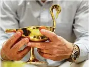  ?? Elizabeth Conley photos / Houston Chronicle ?? Among Adler’s latest brass pieces is a bird bowl of which he’s particular­ly proud. He uses one in his own home.