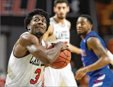  ?? JASON E. MICZEK / ASSOCIATED PRESS ?? Campbell University guard Chris Clemons drives for a basket versus Presbyteri­an College on Jan. 24, in Buies Creek, N.C. Clemons keeps passing the big names of college basketball’s best all-time scorers.