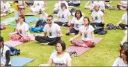  ??  ?? People of Bogota, Colombia, do yoga on Internatio­nal Yoga Day on 21 June.