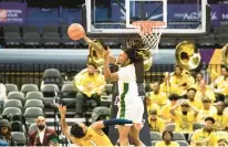  ?? MIKE CAUDILL/FREELANCE ?? Norfolk State forward Kris Bankston blocks a shot by Coppin State’s Justin Steers during the 2022 MEAC Tournament.