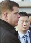  ?? STAFF PHOTO BY MARK GARFINKEL ?? ‘I’M NOT HAPPY’: Mayor Martin J. Walsh, left, speaks with schools chief Tommy Chang yesterday.
