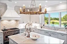  ?? Simon Berlyn ?? IN WESTLAKE VILLAGE, an Italianate-style four-bedroom house owned by Wayne and Janet Gretzky sold for $4.2 million.