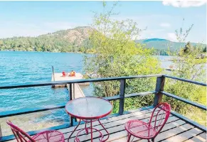  ?? DEBRA BRASH ?? Mount Baldy on Shawnigan Lake is directly across the lake from homeowner Netta Bos’ vintage cabin. This view from the deck of the smaller of the two, called The Birdhouse.