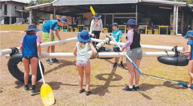  ??  ?? RAFT BUILDING: St Rita's Babinda students, from left, Georgina Stone, Jamie Brose, Saffron Ripps and Harrison Stone work with friends to build a raft for the big race.