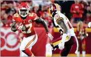  ?? ED ZURGA ?? Kansas City Chiefs running back Kareem Hunt (27) runs away from Washington Redskins cornerback Bashaud Breeland (26) during the second half of an NFL football game in Kansas City, Mo., Monday.