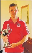  ??  ?? Oban Saints captain Dene Cassells with the Argyll and Bute Cup.