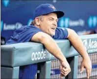  ?? CANADIAN PRESS/AP, CHARLIE RIEDEL ?? Toronto Blue Jays manager John Gibbons watches from the dugout before the team’s baseball game against the Kansas City Royals on Friday, June 23, 2017, in Kansas City, Mo. Blue Jays general manager Ross Atkins may be looking to next season, but manager...