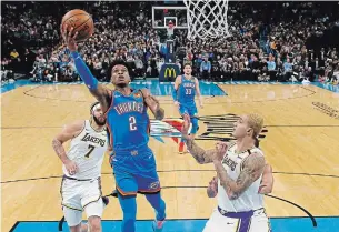  ?? SUE OGROCKI THE ASSOCIATED PRESS ?? Thunder guard Shai Gilgeous-Alexander goes to the basket Saturday in Oklahoma City. Gilgeous-Alexander recorded a triple-double Monday with 20 points, 20 boards and 10 assists.