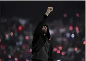  ?? WALLY SKALIJ — LOS ANGELES TIMES ?? Eminem performs during halftime of Super Bowl LVI at SoFi Stadium on Feb. 13 2022, in Inglewood, California