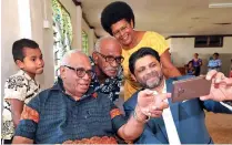  ?? Photo: DEPTFO News ?? Attorney-General and Minister for Economy Aiyaz Sayed-Khaiyum takes a selfie with members of Bureta Village during the launch of the Ovalau Solar Initiative.