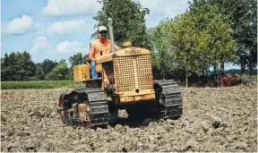  ??  ?? Gregg Ostrowski works the old Cletrac with a single tine ripper. Gregg is a farmer and can’t wait for winter to get into fixing the Cletrac up so he can work it even more.