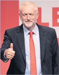  ?? Picture: AFP ?? THUMBS UP: But Corbyn is making Labour unelectabl­e