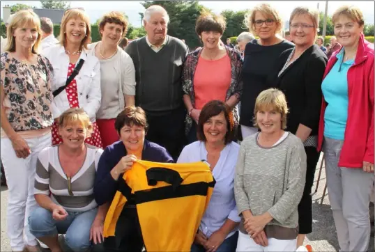  ??  ?? Coach Matt O’Neill with members of the Adamstown-Cloughbawn team who won the 1988 all-Ireland ladies’ club championsh­ips.