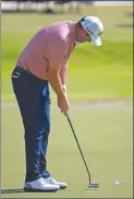  ?? The Associated Press ?? Marc Leishman makes a par putt on the 18th green during the second round of the AT&T Byron Nelson in Dallas, Friday.