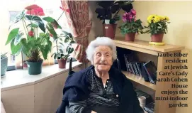  ??  ?? Taube Biber resident at Jewish Care’s Lady Sarah Cohen House enjoys the mini-indoor garden