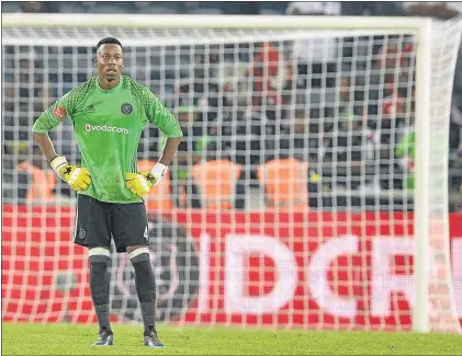  ?? PHOTO: LEFTY SHIVAMBU/GALLO IMAGES ?? Happy Jele in goal for Orlando Pirates after Jackson Mabokgwane was sent off during the Absa Premiershi­p match against Bidvest Wits at Orlando Stadium.