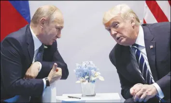  ?? AP PHOTO ?? U.S. President Donald Trump, right, meets with Russian President Vladimir Putin at the G-20 Summit in Hamburg, Germany.