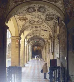  ??  ?? Bologna is known for its many porticos or arched walkways. These porticos are inside the University of Bologna, the oldest university in the world. Painted all over its walls are the crests of its earliest students, who came from the far ends of the...