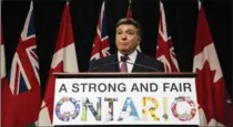  ?? CHRISTOPHE­R KATSAROV, THE CANADIAN PRESS ?? Ontario Finance Minister Charles Sousa speaks to reporters in Queen’s Park in Toronto on Tuesday,