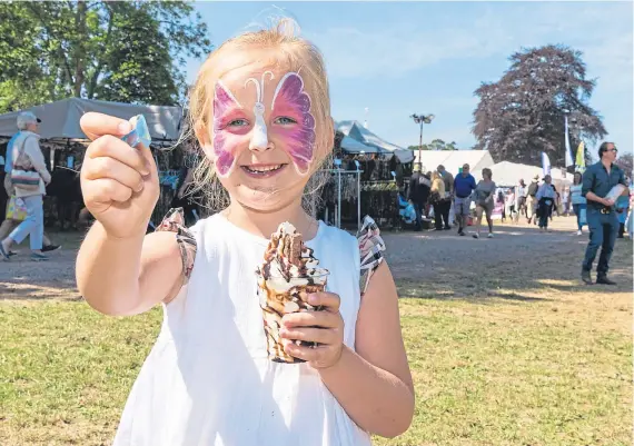  ?? Picture: Steven Brown. ?? Wanna lick? Five-year-old Ava Flett from Perth enjoys an ice cream at the Scottish Game Fair yesterday.