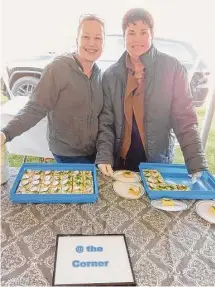  ?? Emily M. Olson/Hearst Connecticu­t Media ?? Above Torrington’s homeless shelter and food pantry held “A Tasteful Event” food tasting fundraiser May 17 at the Five Points Arts Center. Noujaim’s Mediterran­eam Bistro owner George Noujaim serves baclava to Lori Kibbe Lindenmuth. Right: @ the Corner restaurant owner Jayne Lamphear and staff member Sarah Lamb serve from their table at the party.