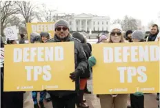  ?? Reuters ?? Demonstrat­ors hold signs protesting the terminatio­n of Salvadoran­s’ Temporary Protected Status (TPS) in front of the White House in Washington, DC, on Tuesday. —