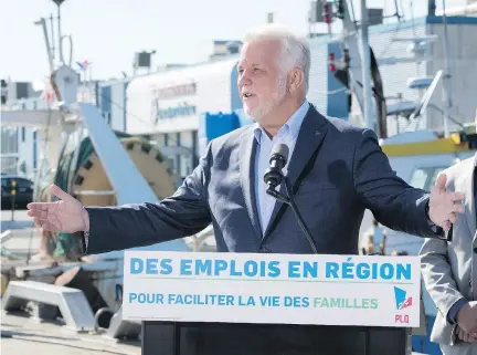  ?? JACQUES BOISSINOT/THE CANADIAN PRESS ?? Liberal Leader Philippe Couillard was in Gaspe on Tuesday, where he defended the Apuiat project.