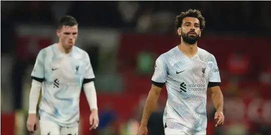  ?? PIC: GETTY IMAGES ?? Beaten: Liverpool’s Salah and Robertson trudge from the pitch at Old Trafford