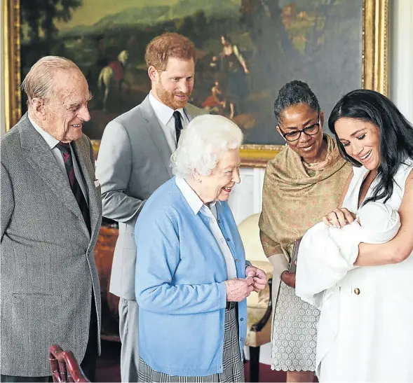  ?? Picture: Chris Allerton/Copyright SussexRoya­l/Pool via Reuters ?? ALL IN THE FAMILY The Duke and Duchess of Sussex are joined by her mother, Doria Ragland, as they show their new son, named Archie Harrison Mountbatte­n-Windsor, to Queen Elizabeth and the Duke of Edinburgh at Windsor Castle. There is no official word on how they came by the baby’s name.