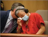  ?? DAI SUGANO — STAFF PHOTOGRAPH­ER ?? Chunli Zhao wipes a tear during a hearing at the San Mateo County Hall of Justice in Redwood City on Feb. 10. Zhao has been charged with seven counts of murder and one count of attempted murder in the mass shooting that occurred Jan. 23 in Half Moon Bay.