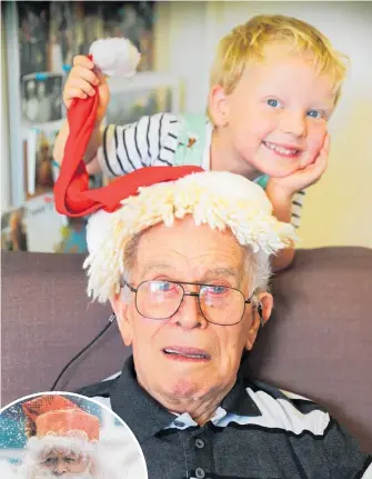  ?? Photo / Doug Sherring ?? Trevor Audain, 94, with his great-grandson Miller Calder, 5. Left: Audain as Santa.