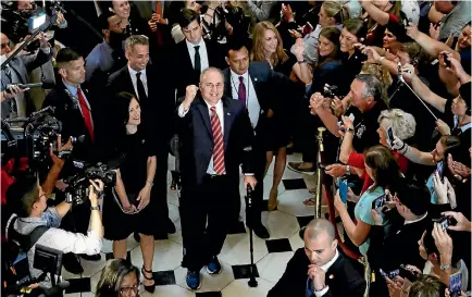  ?? PHOTO: REUTERS ?? US Representa­tive Steve Scalise, with his wife Jennifer at his side, pumps his fist as he makes his way through the US Capitol after returning to Congress for the first time since being shot and seriously wounded in June.