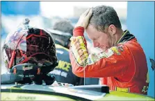  ?? PRESS] [NAM Y. HUH/THE ASSOCIATED ?? Dale Earnhardt Jr., checks his hair Saturday during the final practice for the NASCAR Cup Monster Energy Series race at Chicagolan­d Speedway in Joliet, Ill.