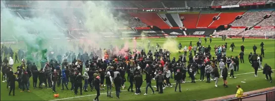  ??  ?? Manchester United’s game against Liverpool was postponed on Sunday evening after fan protests at Old Trafford against the Glazer family’s ownership of Manchester United