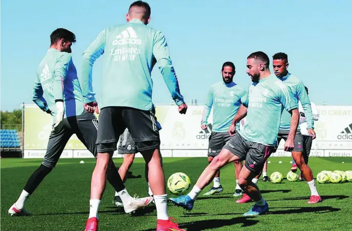  ?? REALMADRID.COM ?? Carvajal entrenó ayer con el grupo pero todavía no está disponible. Valverde, Isco y Mariano sí entraron en la convocator­ia para Getafe