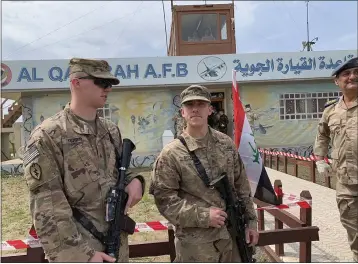  ?? ALI ABDUL HASSAN — THE ASSOCIATED PRESS FILE ?? U.S. soldiers stand guard during the hand over ceremony of Qayyarah Airfield, Iraqi Security Forces, in the south of Mosul, Iraq.