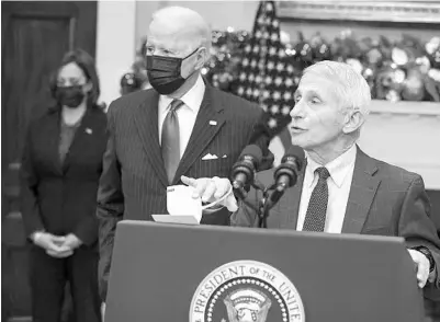  ?? ABACA PRESS ?? Anthony Fauci, right, joined by President Joe Biden and Vice President Kamala Harris, discusses the omicron variant on Monday.