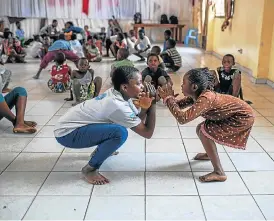  ?? /Thomson Reuters Foundation ?? Got the moves: Children learn capoeira movements at Goma’s Heal Africa Hospital, which treats gender-based violence in the Democratic Republic of the Congo.