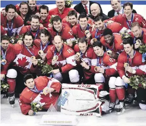  ?? NATHAN DENETTE/ THE CANADIAN PRESS ?? Team Canada poses for a team picture after defeating Sweden to win the gold medal at the 2014 Sochi Winter Olympics in Sochi, Russia.