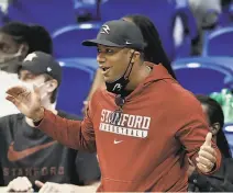  ?? Elsa / Getty Images ?? Seattle Seahawks quarterbac­k Russell Wilson cheers on his sister Anna, a senior guard, during the Cardinal’s victory.