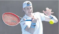  ??  ?? John Isner of the US hits a return against Reilly Opelka of the US during their men’s singles match on day one of the Australian Open tennis tournament in Melbourne on January 14, 2019. - AFP photo