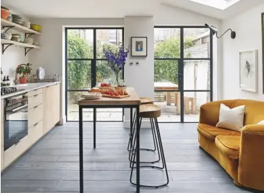  ??  ?? DINING AREA
Built-in storage painted in a bold shade of blue makes an eye-catching statement.
Unit in Hague Blue estate eggshell, £62 for 2.5ltr, Farrow & Ball. Timothy Oulten Akel MK2 table, £1,575; Olson pendant lights, from £99 each, all Heal’s. Ercol Quaker chairs, £435 each, Choice Furniture Superstore, are similar