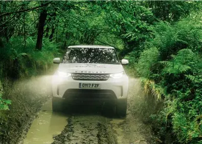  ??  ?? Above and left: Greasy, rutted tracks, lubricated by a constant drizzle, proved no challenge at all to the Discoverys from the Land Rover Experience fleet