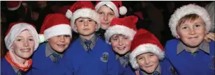  ??  ?? Jake Byrne, Billy O’Reilly, Charlie Maguire, Tristan Doherty, Jack Cooper, Joshua Mahon and Tadhg Treacy from St Cronan’s choir at last year’s switching on of the Bray lights.