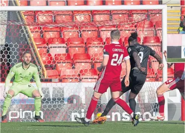  ??  ?? Jay Emmanuel-thomas was in the right spot to open the scoring for Livingston . . .