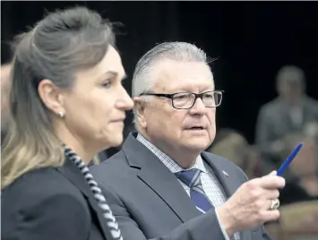  ?? ADRIAN WYLD/ THE CANADIAN PRESS ?? Communicat­ions Security Establishm­ent chief Greta Bossenmaie­r speaks with Public Safety Minister Ralph Goodale as they wait to appear before the Standing Committee on Public Safety and National Security, in Ottawa on Thursday.