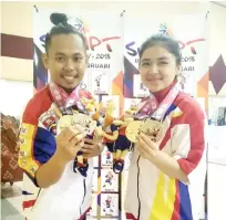  ??  ?? Poomsae duo Ahmady and Nur Ifa win gold and silver medals in the mixed, individual and team events.