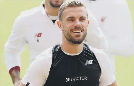  ??  ?? Wearsider Jordan Henderson is all smiles in training ahead of Liverpool’s Champions League final clash with Real Madrid.