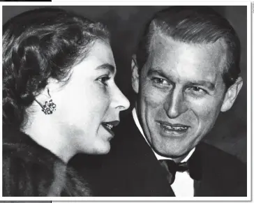  ??  ?? I ONLY HAVE EYES FOR YOU: Philip looks adoringly at the Queen at a circus in London in December 1952. Her Coronation was the following June