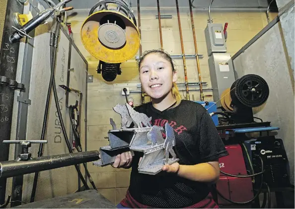  ?? LARRY WONG ?? Gwen Arcand, 14, shows off her welding project at NAIT on Friday after graduating from a summer welding camp.